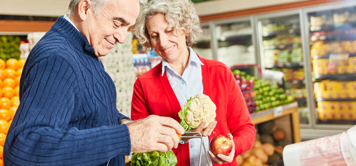 september 2022 age pension increase to help senior couple shopping for vegetables