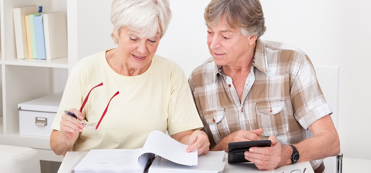 older couple looking at super fund returns