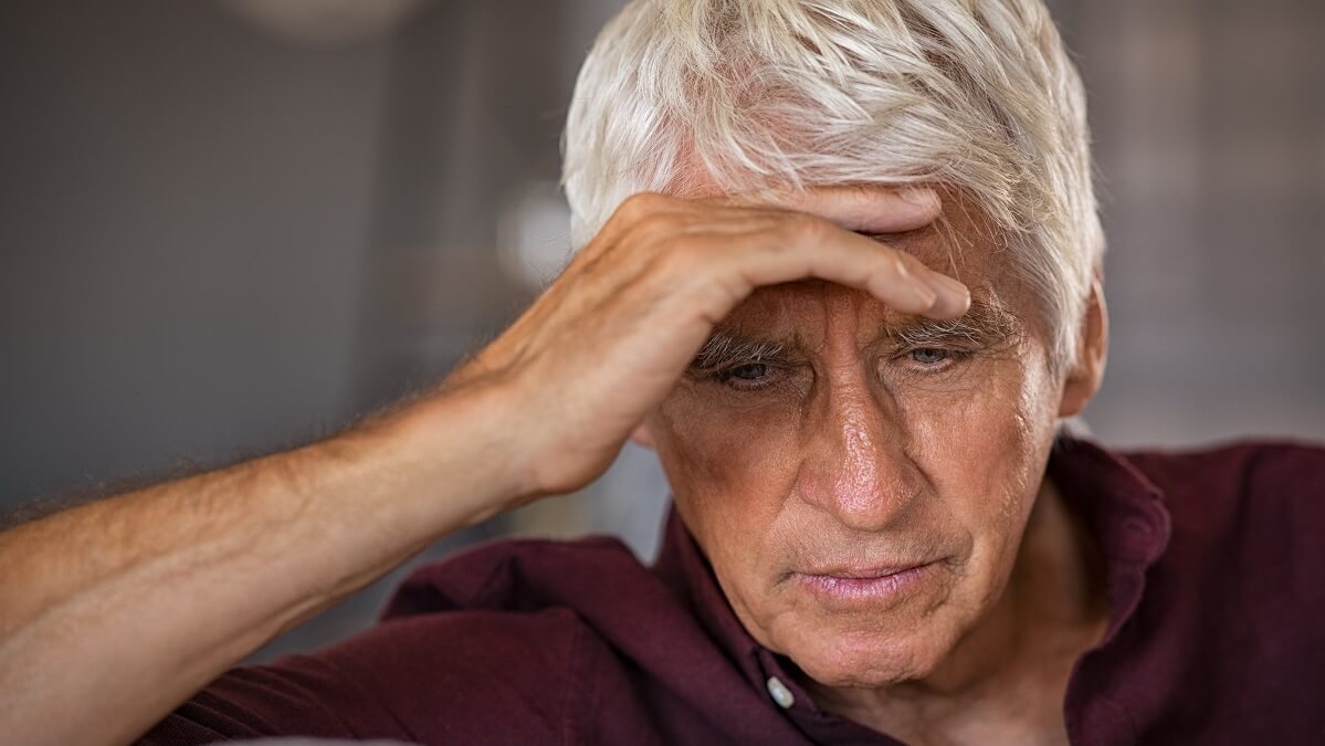 older man suffering from undiagnosed adhd