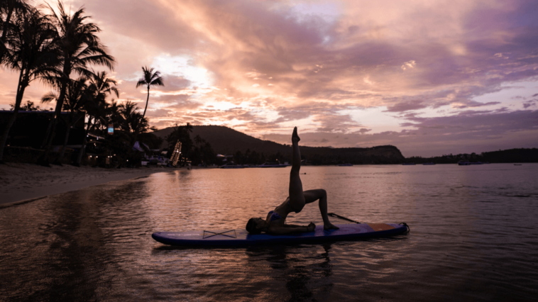 Woman doing yoga on a paddleboard