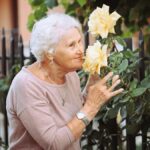 woman with dementia smelling plants