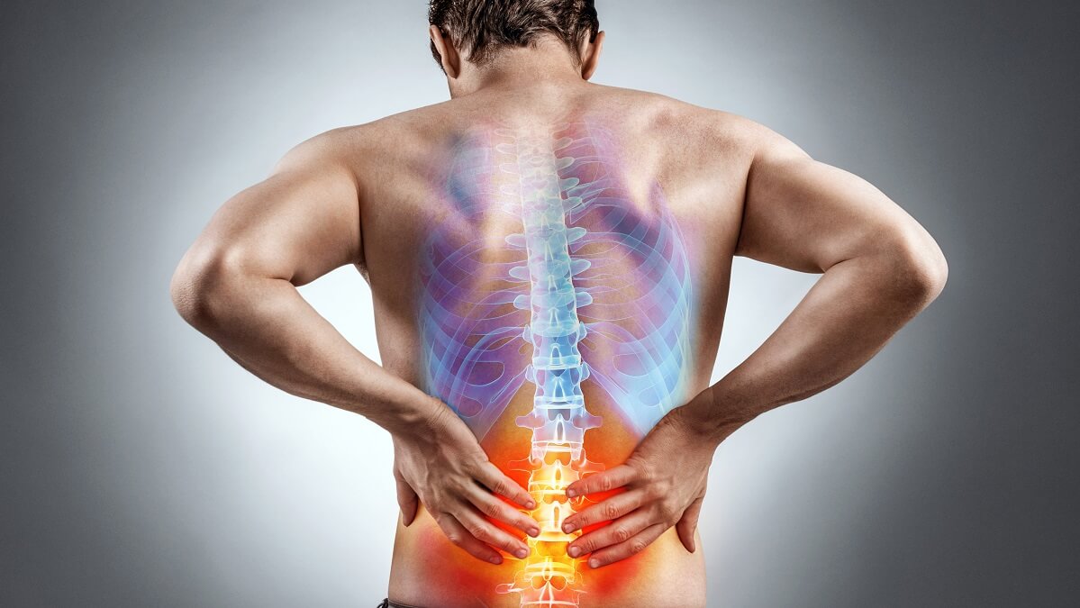 man experiencing chronic back pain