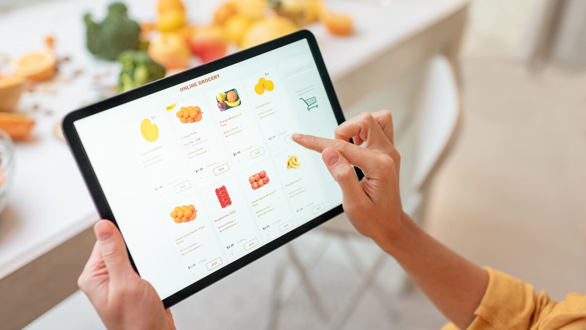woman shopping for groceries through online delivery services