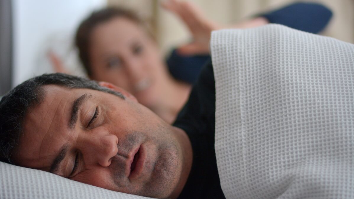 woman frustrated by partner's snoring