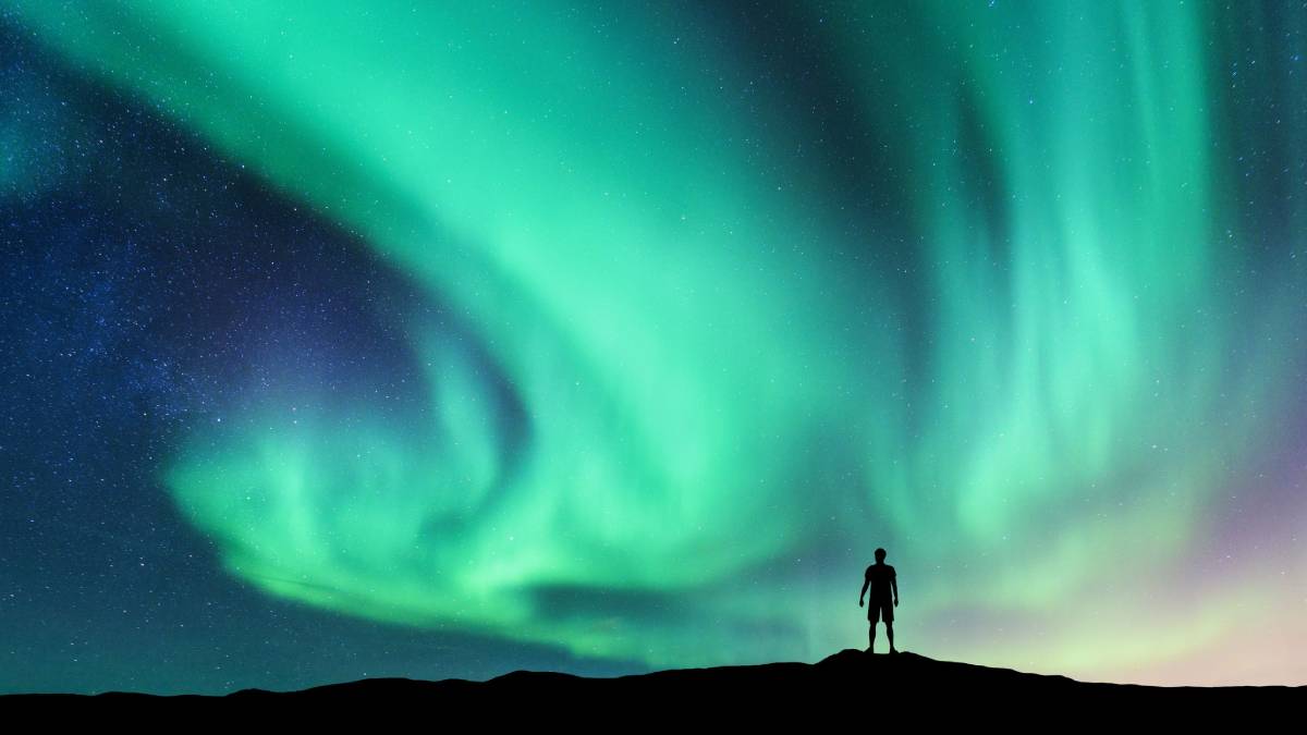 Northern lights with a silhouette of a man