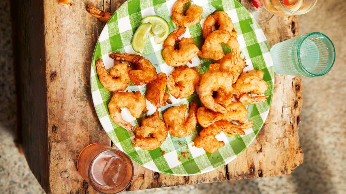 Ginger beer prawns on a green plate