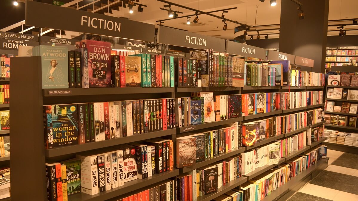 shelves of fiction books in store