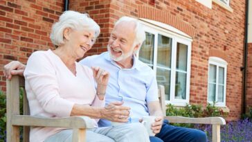 older couple discussing the transition to retirement living