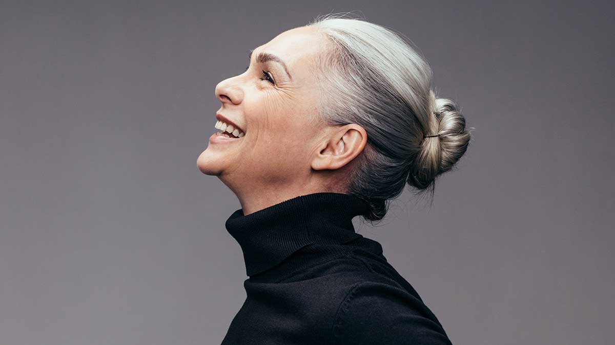 happy older woman with grey hair
