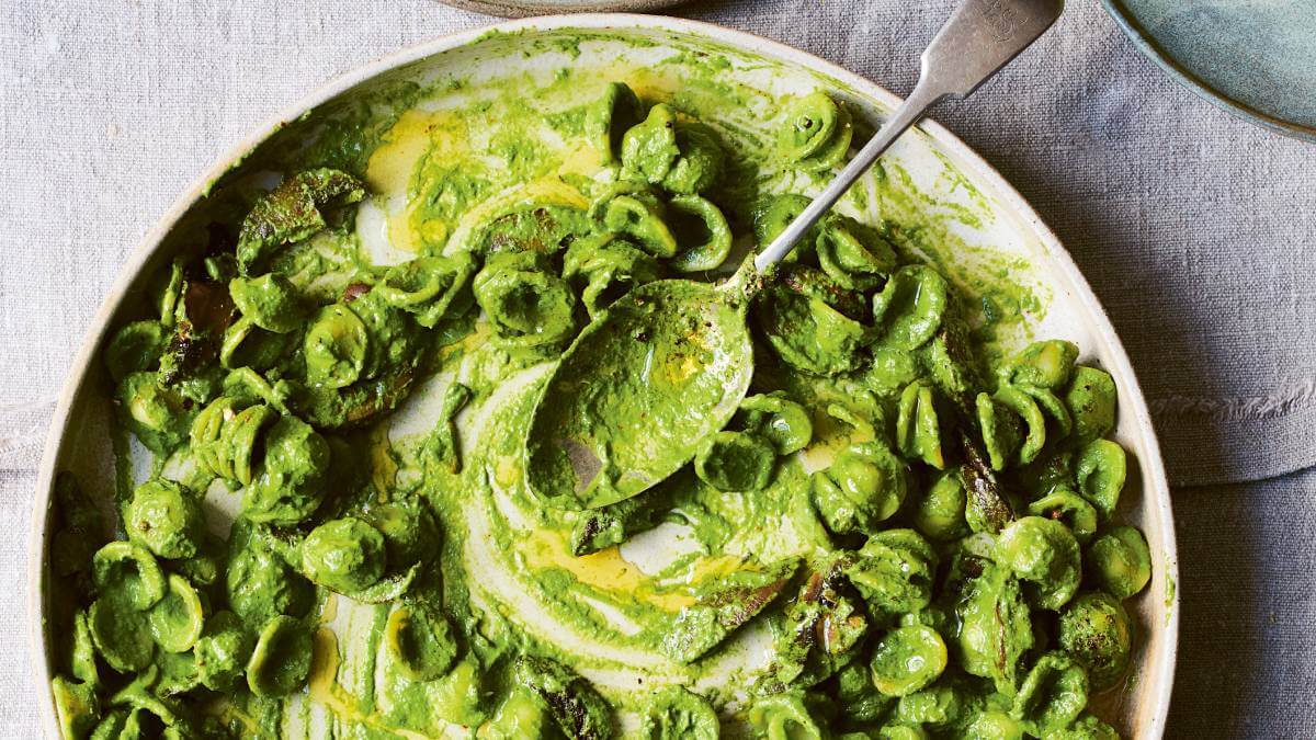 Pasta with a green sauce in a dish