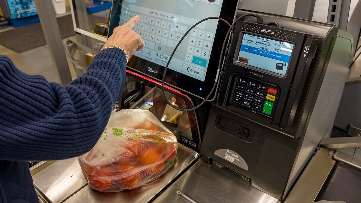 customer scanning vegetables