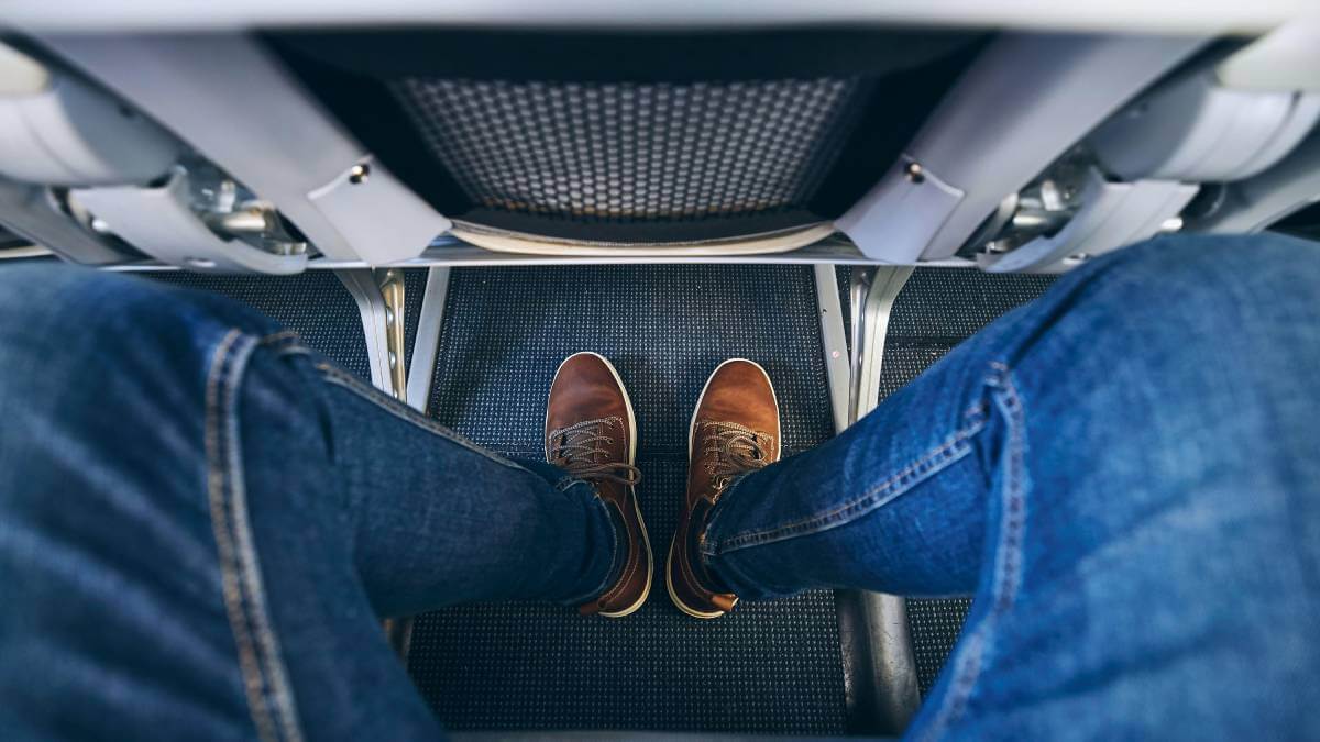Legs in an airplane seat
