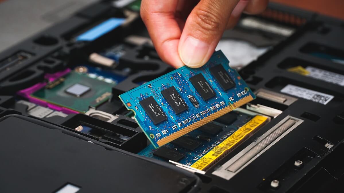 technician upgrading laptop parts