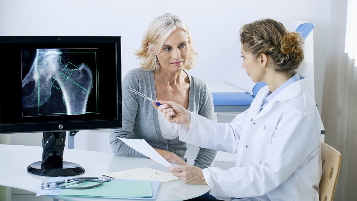 woman discussing bone density scan with doctor