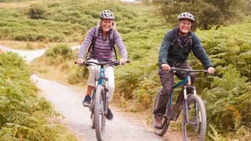 middle aged couple recreational cycling