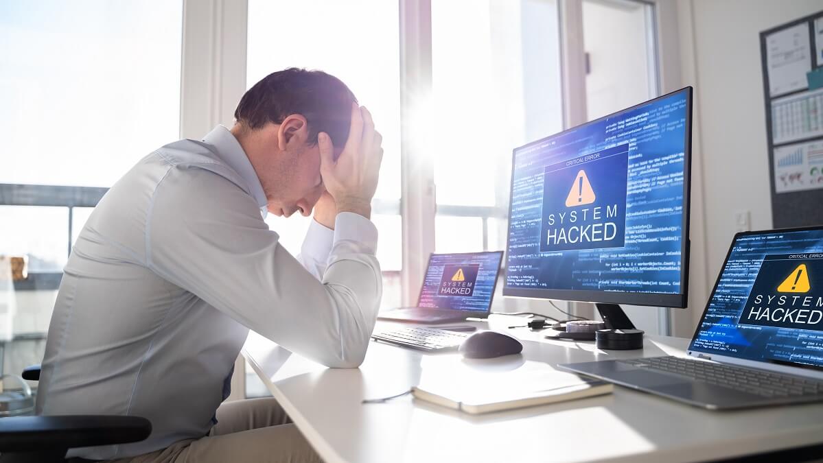 stressed man experiencing ransomware attack