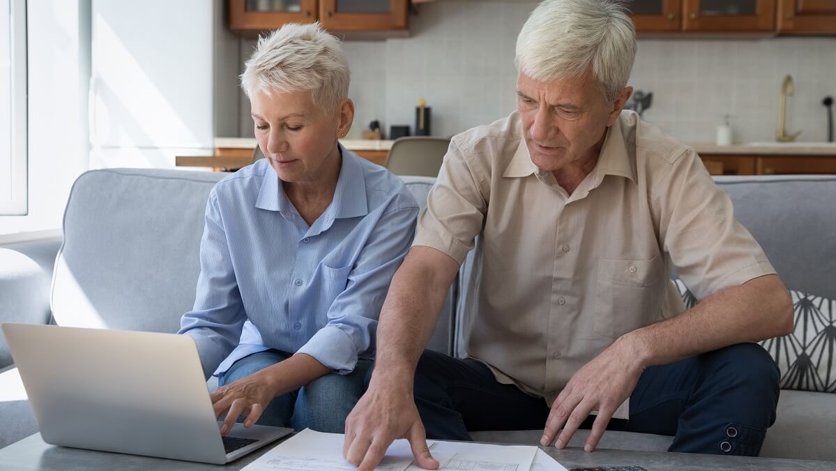older couple calculating super tax concessions