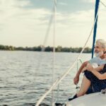 Couple sat at the front of a boat