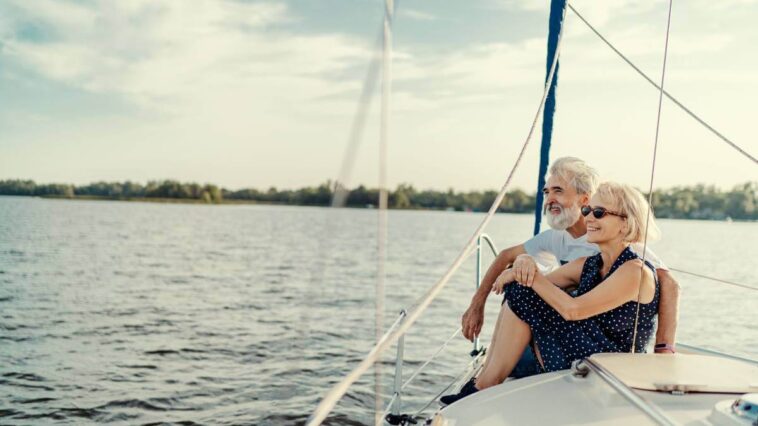 Couple sat at the front of a boat
