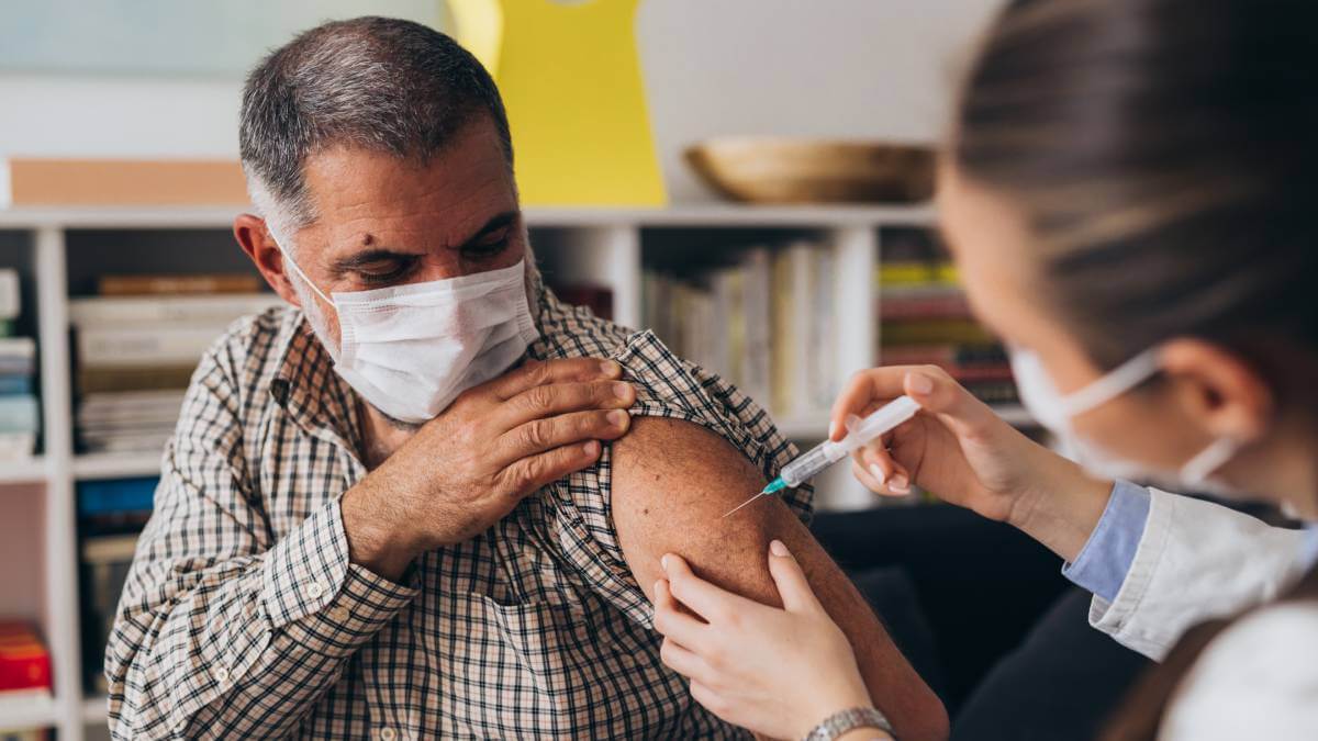 man getting a flu shot