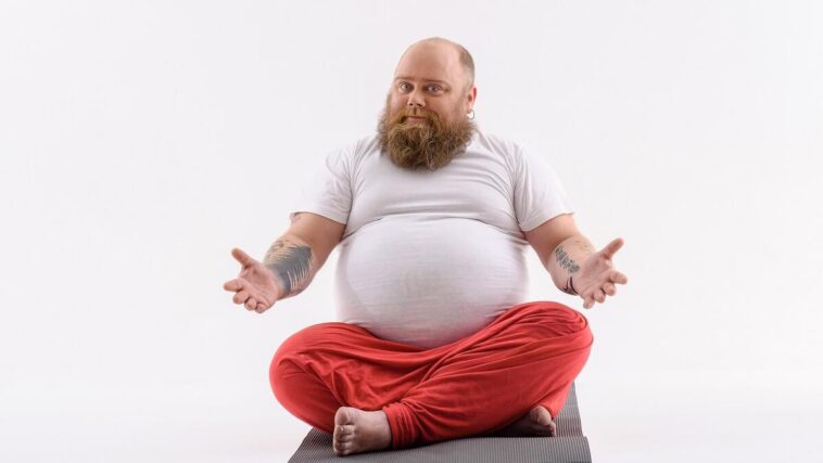 fat man doing yoga