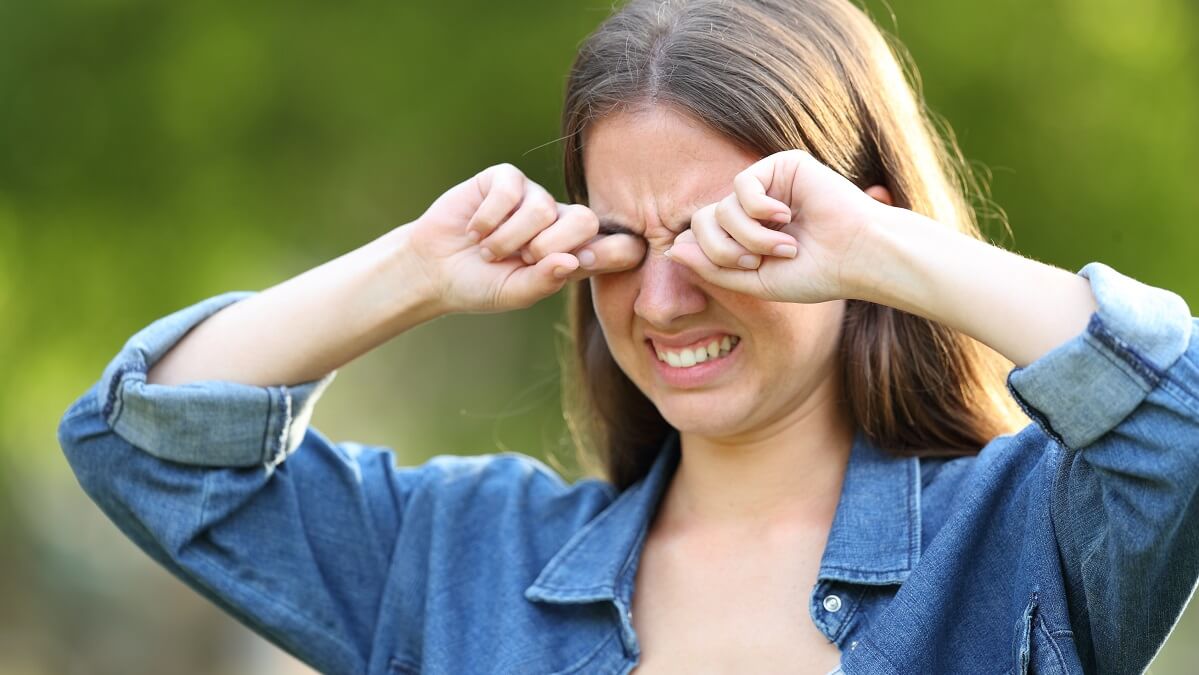 woman treating dry eye disease