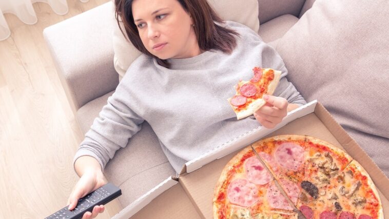 woman stress eating junk food
