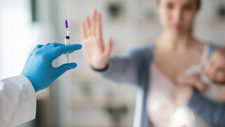 woman refusing vaccine