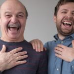 father and son laughing at joke