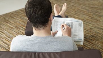 man does crossword to protect against dementia