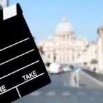 movie clapboard in front of st peters basilica