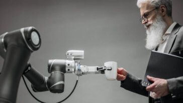 Man taking cup from a robot