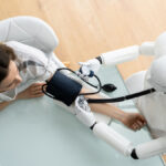 robotic doctor taking blood pressure of patient