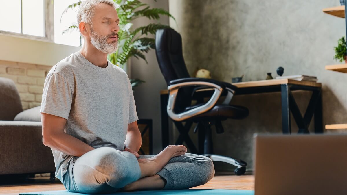 older man trying to improve flexibility