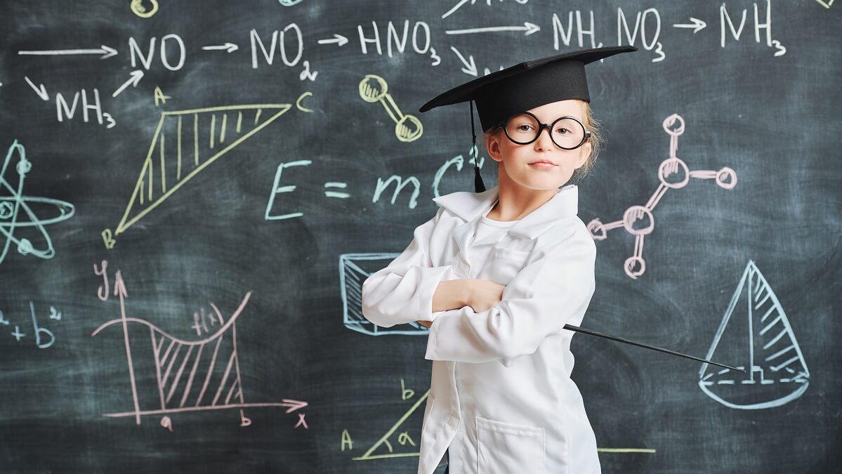 clever kid in front of blackboard
