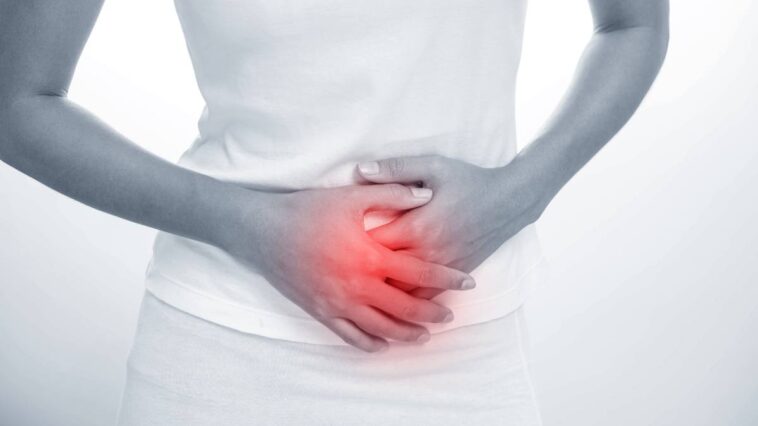 Woman with sore stomach