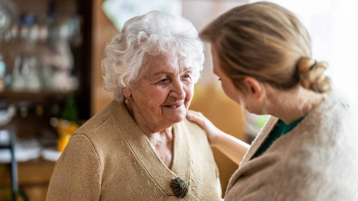 Woman looking after an elderly relative