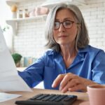retired woman calculating finances