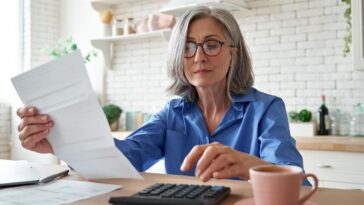 retired woman calculating finances
