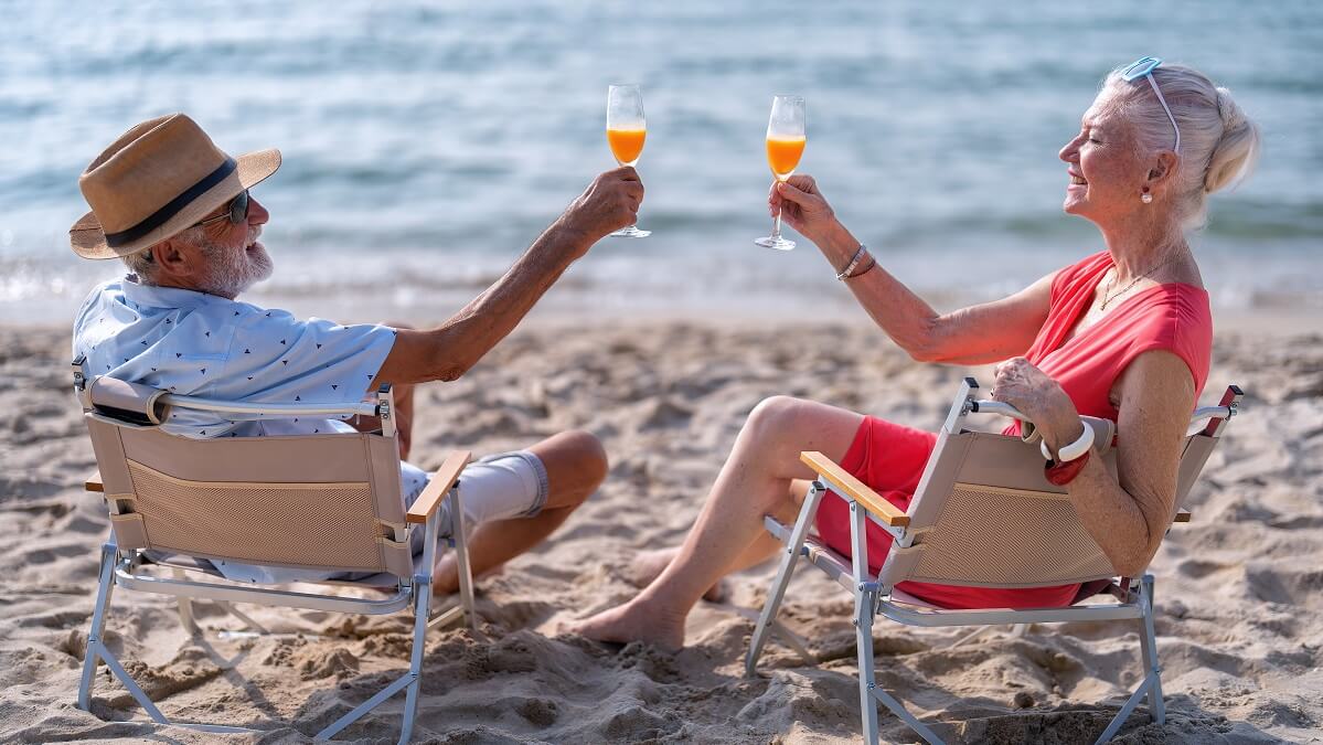 rich retirees sitting on beach