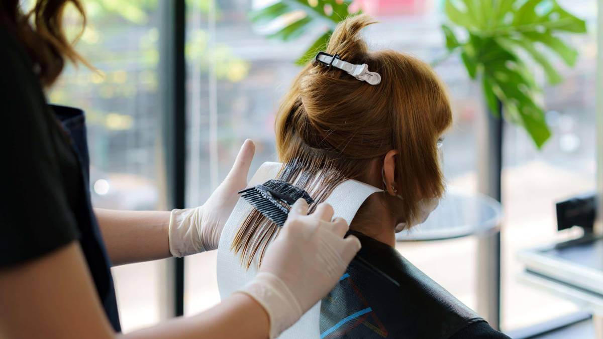 Woman having her hair coloured in a salon