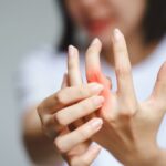 woman suffering from hand osteoarthritis