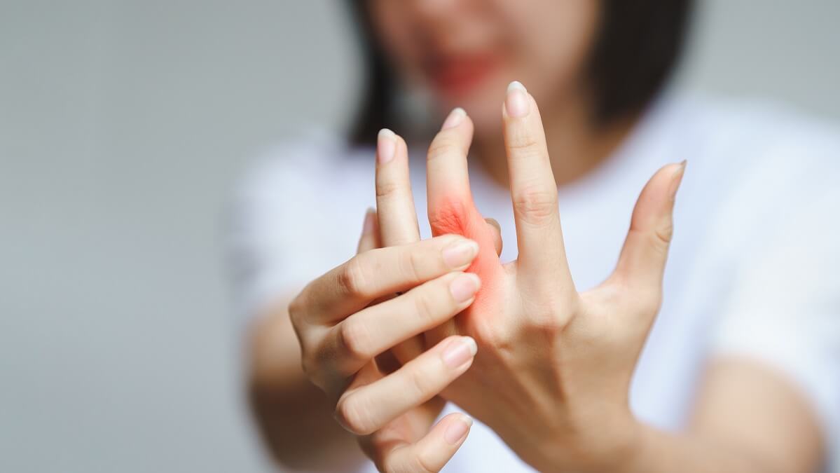 woman suffering from hand osteoarthritis