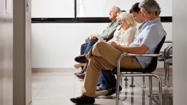 people sitting in doctors waiting room