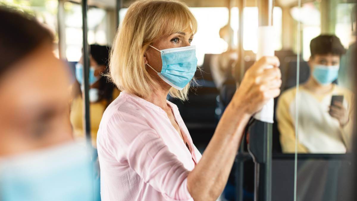 Woman wearing a mask on public transport
