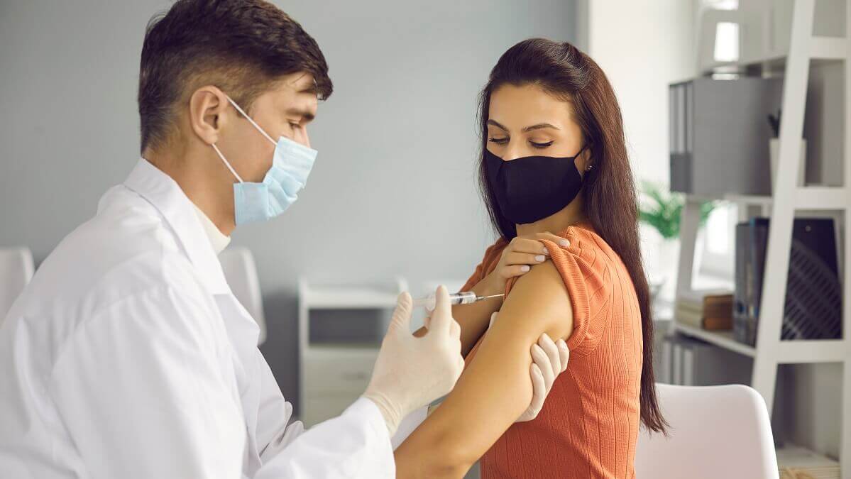 A doctor giving a vaccine
