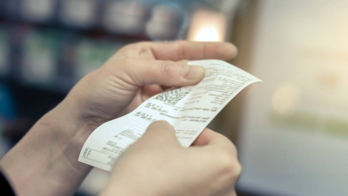 Woman looking at a receipt