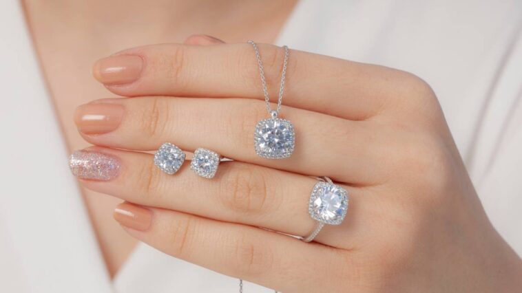 A woman holding diamond jewellery