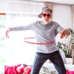 Older man with a hula hoop