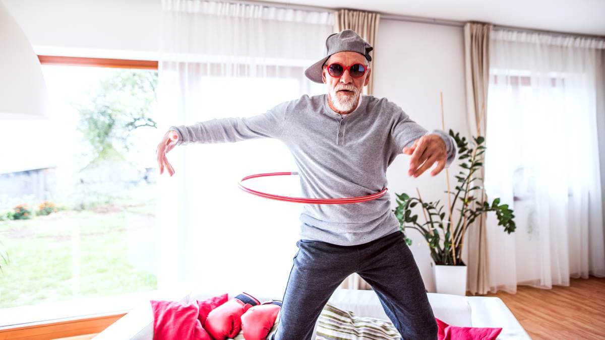 Older man with a hula hoop